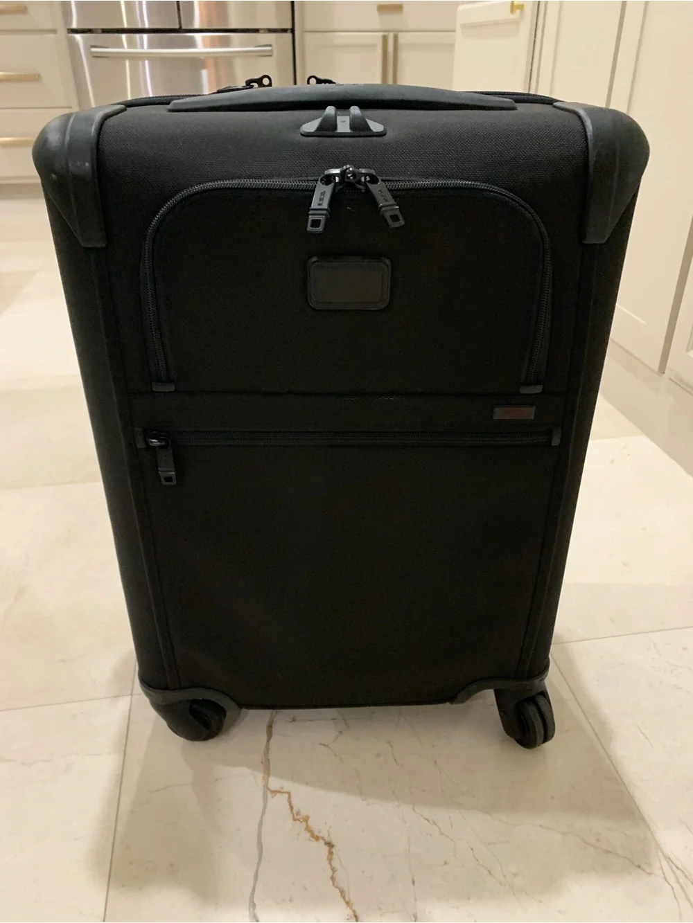 Tumi Black Spinner Carry-On with Front Zip Pocket luggage